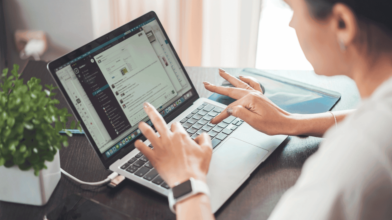 Laptop, books, notebook, and coffee on a peaceful workspace representing digital asset building, online business, and long-term financial freedom.